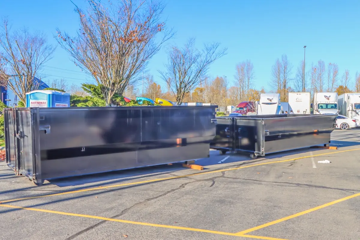 Professional dumpster rental service with roll-off container on residential driveway in Taylor Mill